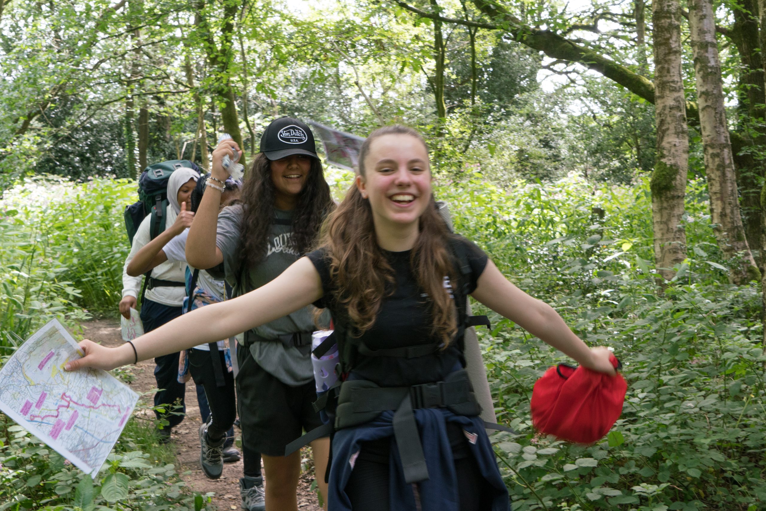 Front to back: Sarah, 14, Paaniz, 14, Lesley, 14 and Naeema, 15, celebrate as they walk the last few metres of their DofE Bronze expedition. This is the first year that Oasis Media City Academy have run the DofE and their first expedition. It is also many of the students first time out of Salford City and been camping.
Oasis Media City Academy is in Salford, one of the top 20 most deprived places in the UK. The DofE was started at the school this year thanks to funding the DofE secured from the Department for Education (DfE) specifically for schools in IMD 1-4. 64 participants signed up, at least two thirds of whom are girls. Being able to offer the DofE for free was the only way students were able to sign up.